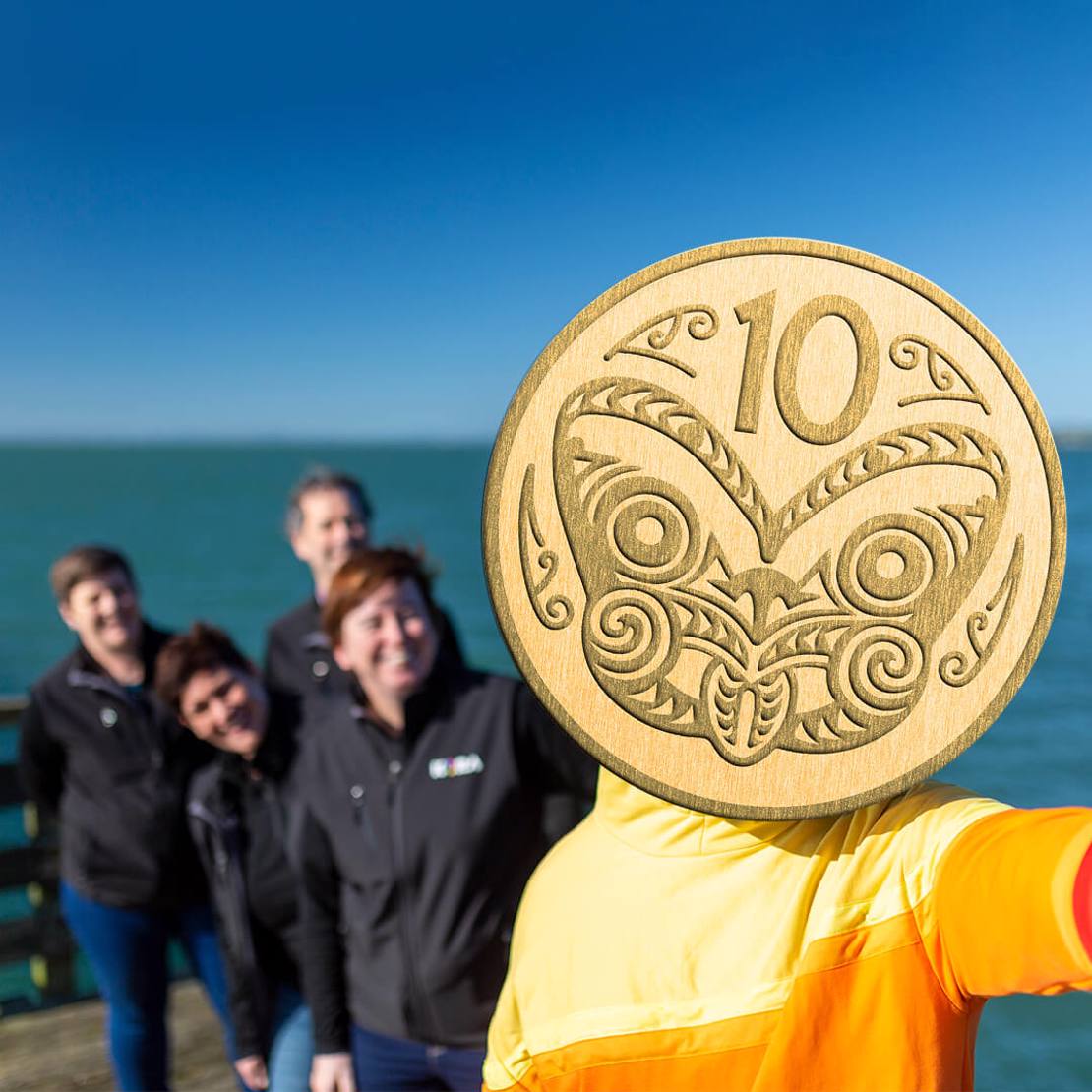New Zealand Kora team members with fuel savings mascot 